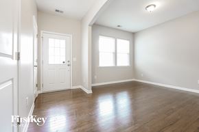 Moncks Corner house for rent - an empty living room with white walls and wood floors