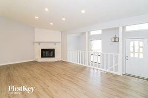 Woodstock house for rent - a living room with a fireplace and a white door