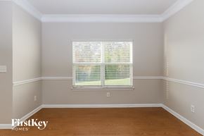 Gastonia house for rent - A room with a window covered in blinds.
