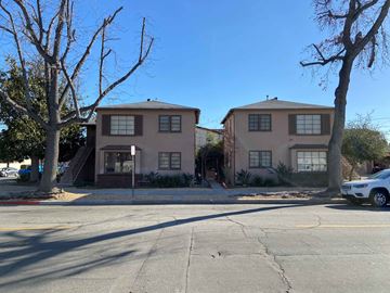 Burbank apartment for rent - a street view of an apartment building with a car parked in front