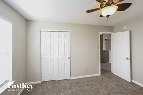 Plainfield house for rent - a bedroom with two closets and a ceiling fan