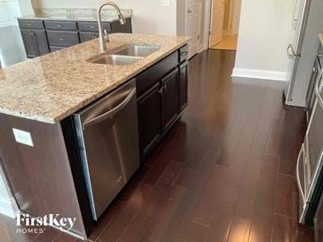 Moncks Corner house for rent - a kitchen with stainless steel appliances and a granite counter top