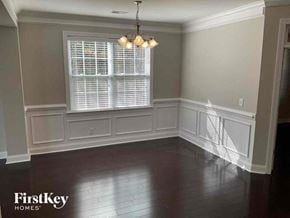 Moncks Corner house for rent - a dining room with white wainscoting and a window
