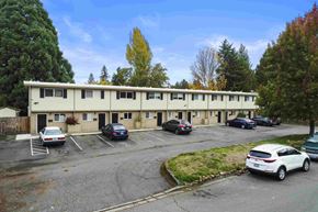 Kent apartment for rent - an office building with cars parked in a parking lot