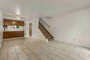 Kent apartment for rent - a living room with a staircase and a tiled floor