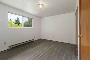 Kent apartment for rent - an empty living room with wood floors and a window