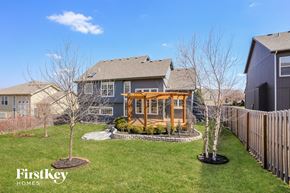 Kansas City house for rent - a backyard with a house and a yard with a gazebo