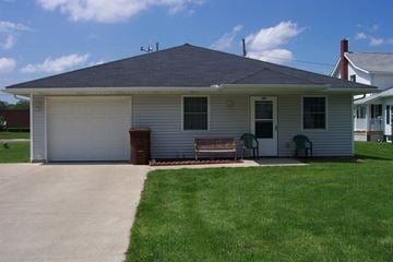 Hartville apartment for rent - A house with a grey roof and a white garage door.