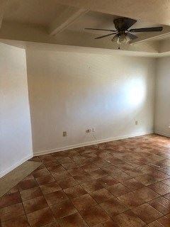 Baton Rouge apartment for rent - an empty room with a ceiling fan and a tiled floor