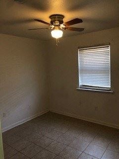 Baton Rouge apartment for rent - an empty room with a ceiling fan and a window