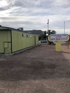 Phoenix apartment for rent - a sign is in front of a green building