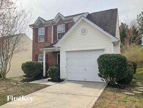 Charlotte house for rent - the front of a house with a white garage door