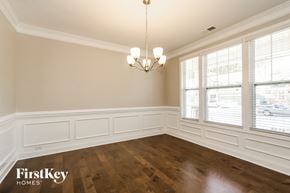 Sherrills Ford house for rent - the dining room of a house with wood floors and a chandelier