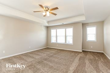 Sherrills Ford house for rent - a living room with carpet and a ceiling fan