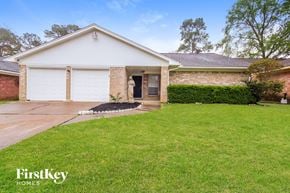 Spring house for rent - A house with a white garage door is for sale.