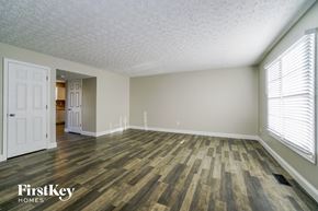 Pickerington house for rent - the spacious living room with wood flooring and white walls