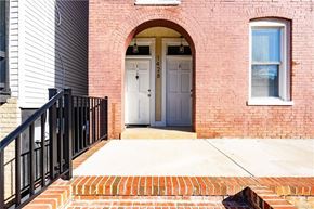Richmond house for rent - the front door of a brick building with a blue door