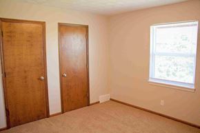 Jefferson City apartment for rent - A room with two doors and a window.