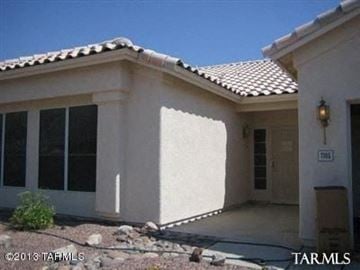 Marana house for rent - A house with a white wall and a brown door.