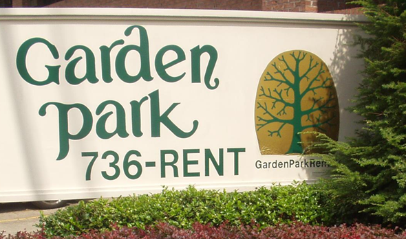 Huntington apartment for rent - a sign for garden park in front of a building