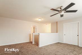 Humble house for rent - a bedroom with a ceiling fan and a door to a closet