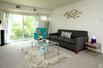Ypsilanti apartment for rent - a living room with a couch and a coffee table