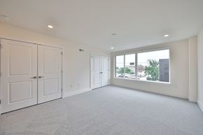 Philadelphia apartment for rent - an empty living room with white walls and a large window