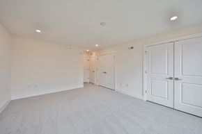 Philadelphia apartment for rent - a bedroom with white closets and white carpeting and white doors