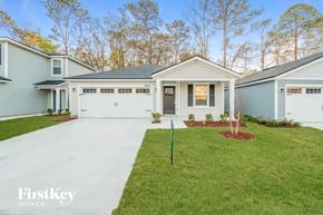 Jacksonville house for rent - a blue and white house with a driveway and lawn