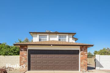 Glendale house for rent - a house with a garage with a brown garage door
