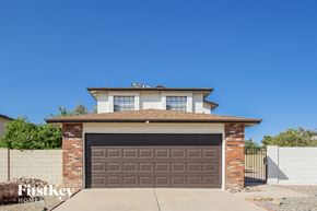 Glendale house for rent - a brown garage door in front of a brick house