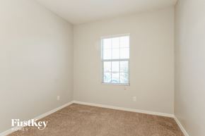 Buckeye house for rent - a bedroom with white walls and carpet and a window