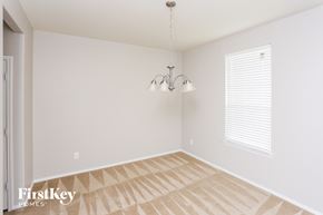 Forney house for rent - a empty room with a chandelier and a window