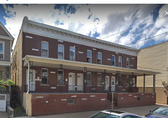 Elizabeth apartment for rent - A red brick building with a white trim and a balcony.