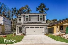 Jacksonville house for rent - a blue house with a white garage door
