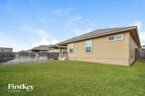 San Antonio house for rent - A house with a fence and a grassy yard.