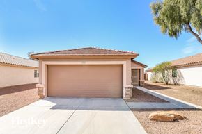 Surprise house for rent - A house with a garage door that says "FirstKey" on it.