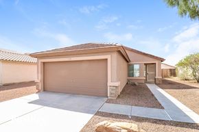 Surprise house for rent - A house with a brown garage door and a brown roof.