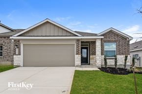 San Antonio house for rent - A house with a garage door and a window is shown.