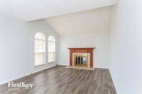 Fairfield house for rent - the living room with wood flooring and a fireplace
