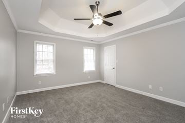 Clemmons house for rent - a living room with carpet and a ceiling fan