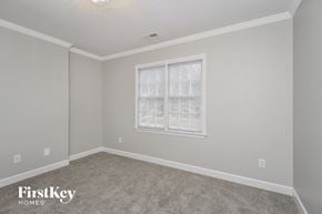 Clemmons house for rent - a bedroom with a carpeted floor and a window