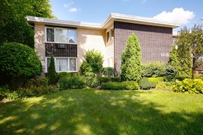 Lisle apartment for rent - A house with a well-kept lawn in front.