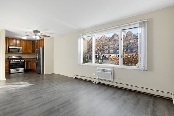 Lisle apartment for rent - A spacious kitchen with wooden cabinets and a refrigerator.