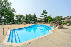 Downers Grove apartment for rent - A rectangular blue swimming pool with a 3 feet depth marking.