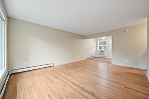 Villa Park apartment for rent - the living room and dining room of an empty house with wood floors