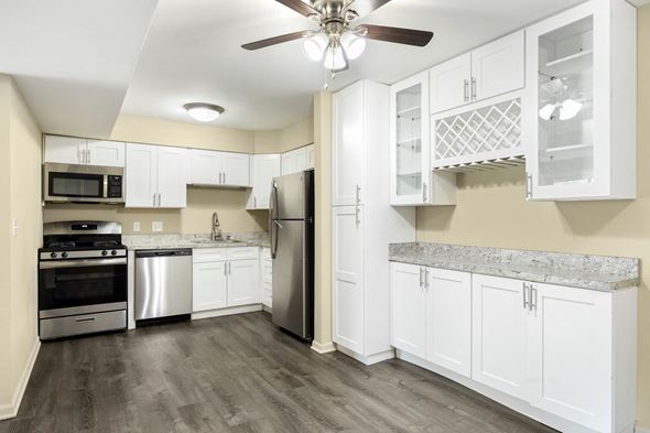 Sleepy Hollow apartment for rent - a renovated kitchen with white cabinets and stainless steel appliances