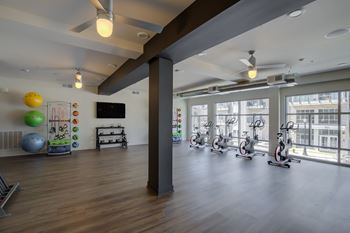 Two-story fitness area with yoga room