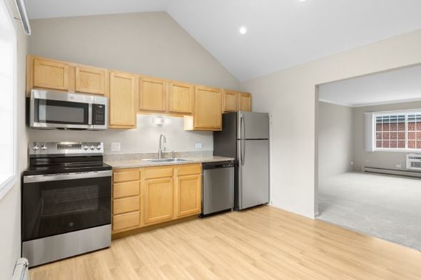 Naperville apartment for rent - A kitchen with wooden cabinets and stainless steel appliances.