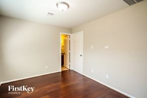Houston house for rent - a living room with wood flooring and a door to a hallway